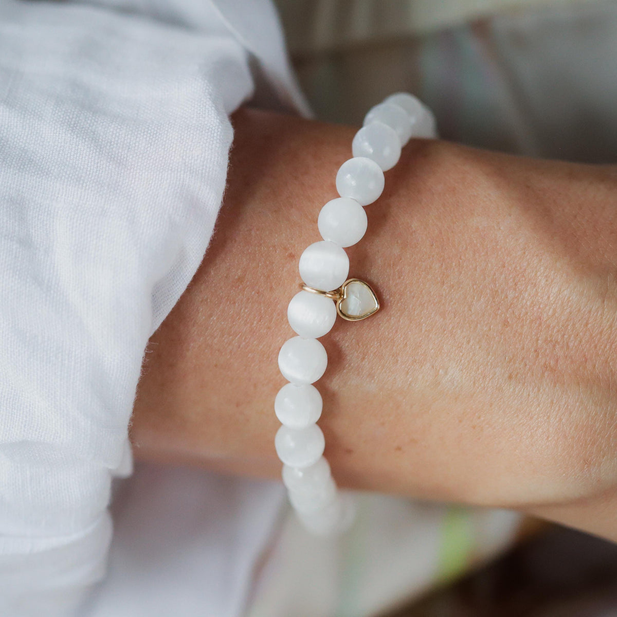 Mother of Pearl Selenite bracelet with 14K accents, featuring smooth, polished beads and elegant design by Earthly Abundance.