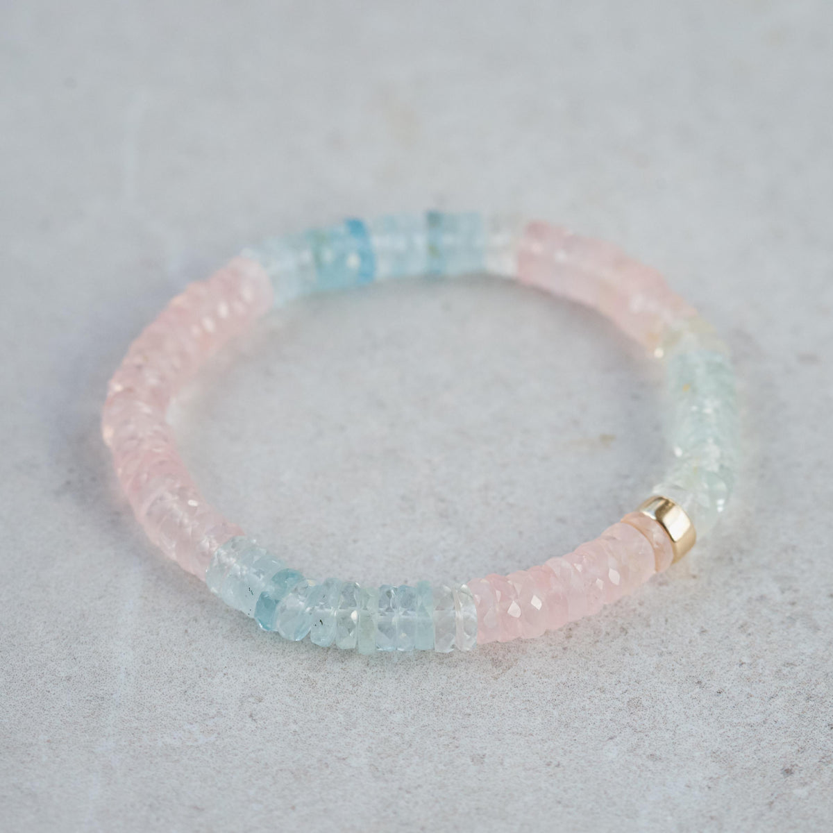Pastel Morganite Beryl Heishi bracelet featuring soft pink and peach hues, strung on a delicate string, by Earthly Abundance.