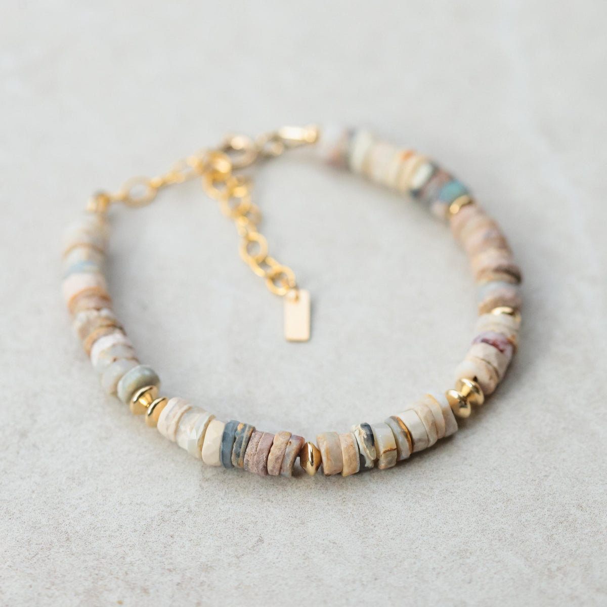 Australian Opal bracelet from Earthly Abundance featuring vibrant, shimmering opal stones set in a delicate silver bracelet.