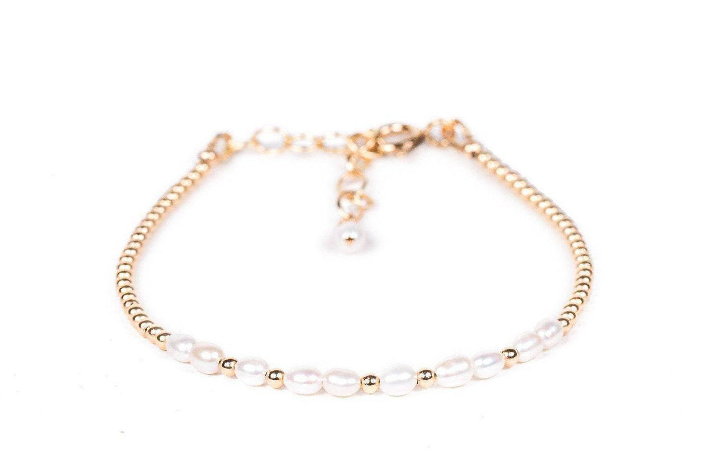 Freshwater pearl necklace from Earthly Abundance Jewelry, featuring a lustrous white pearl on a delicate chain.