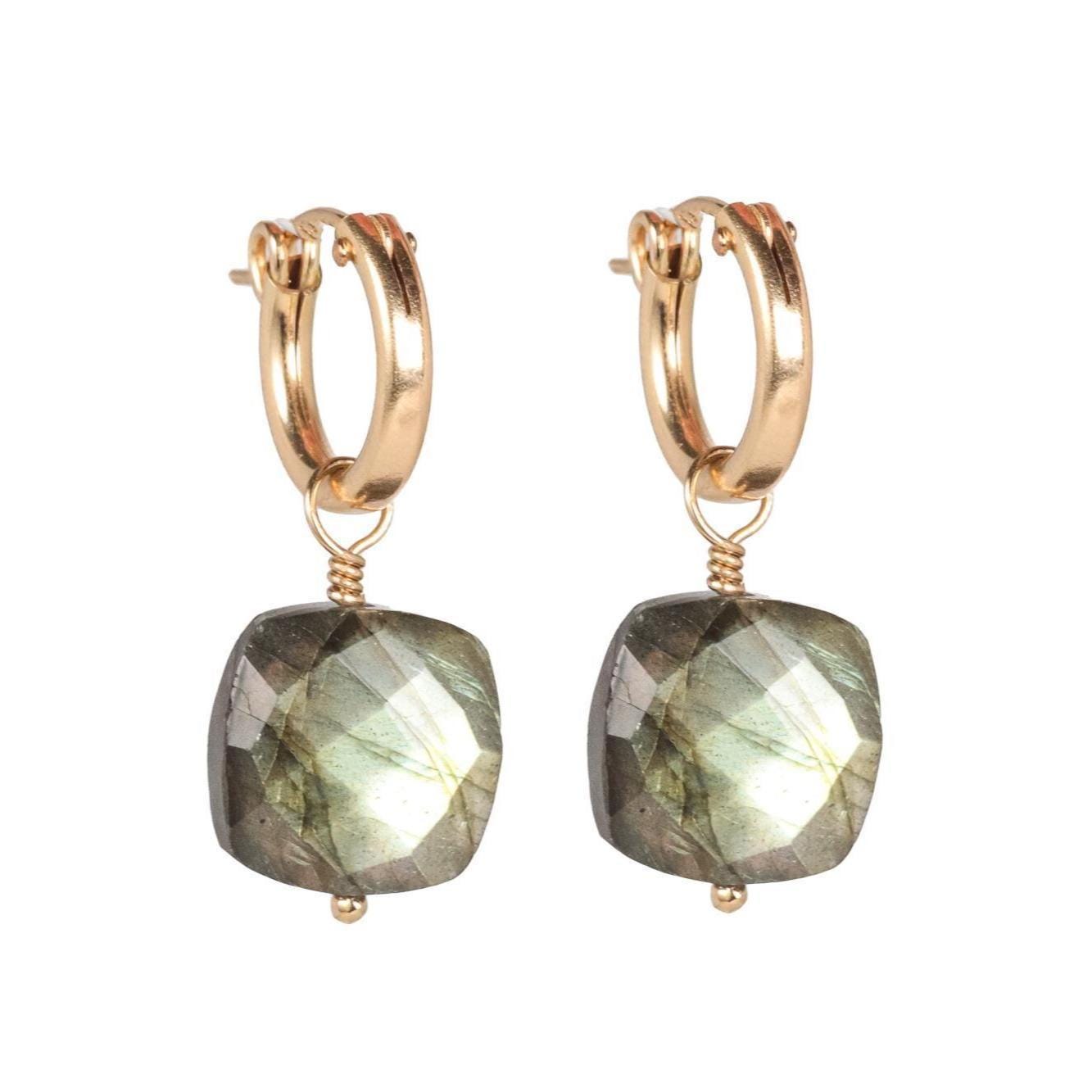 Blue flash labradorite earrings by Earthly Abundance featuring vibrant blue labradorite stones set in elegant earrings.