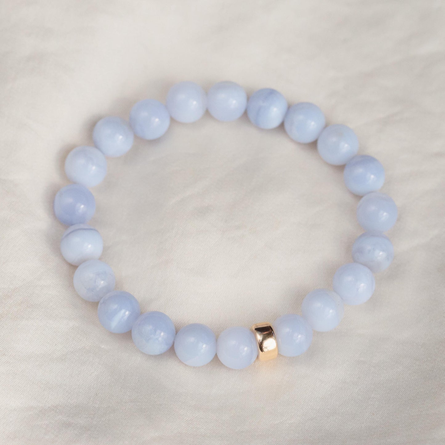 Blue Lace Agate bracelet from Earthly Abundance featuring a string of smooth, polished blue gemstone beads.