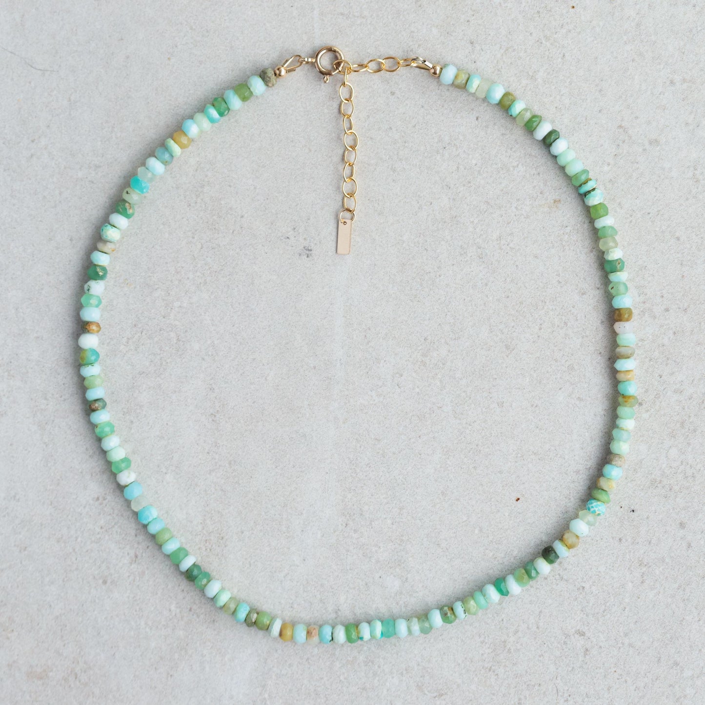 Peruvian Opal necklace with 14K gold-filled chain from Earthly Abundance, featuring a polished oval opal pendant.