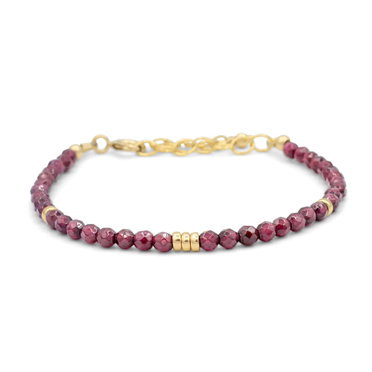 Garnet beaded bracelet by Earthly Abundance Jewelry featuring polished red garnet stones on an elastic band.