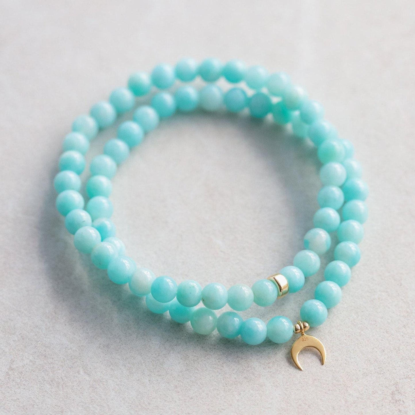 Peruvian Amazonite bracelet with 5mm beads from Earthly Abundance, featuring vibrant blue-green stones on a stretchy cord.