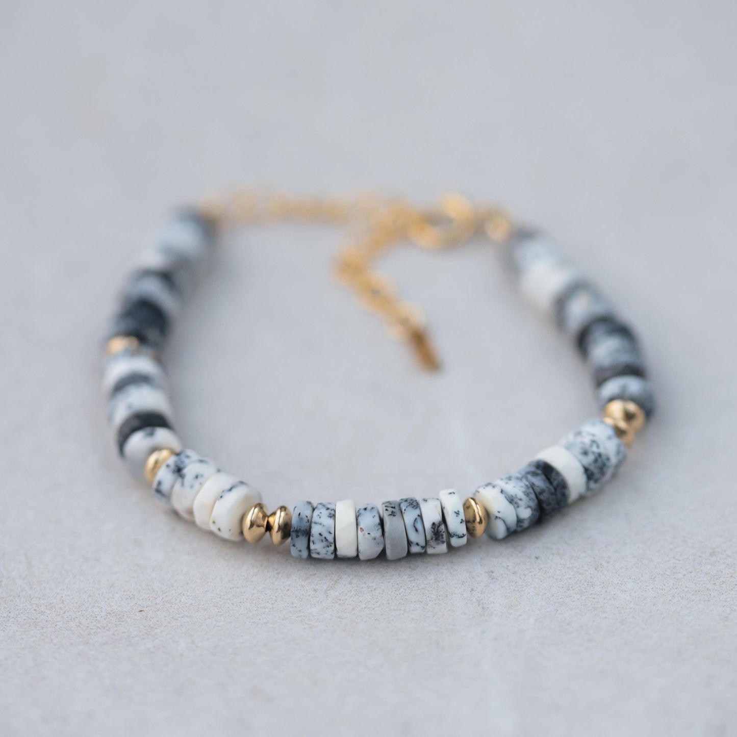 Dendrite Opal bracelet by Earthly Abundance featuring natural stone beads on an elastic cord for stylish wear.