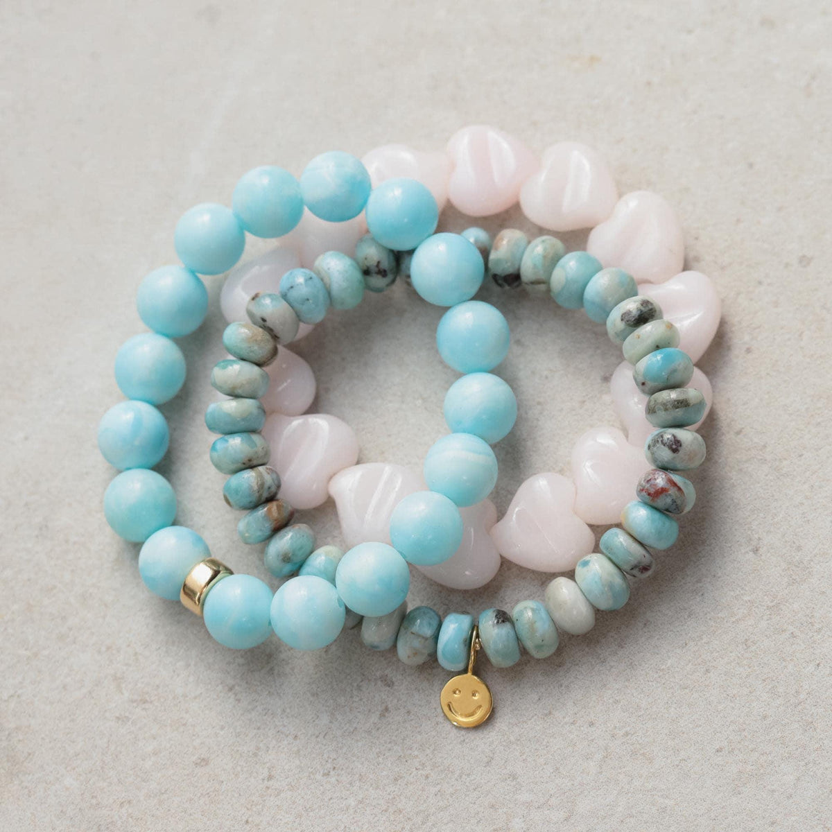 Happy Heart Stack with Mangano Calcite, Hemimorphite, and Larimar crystals from Earthly Abundance, arranged in a balanced gemstone display.
