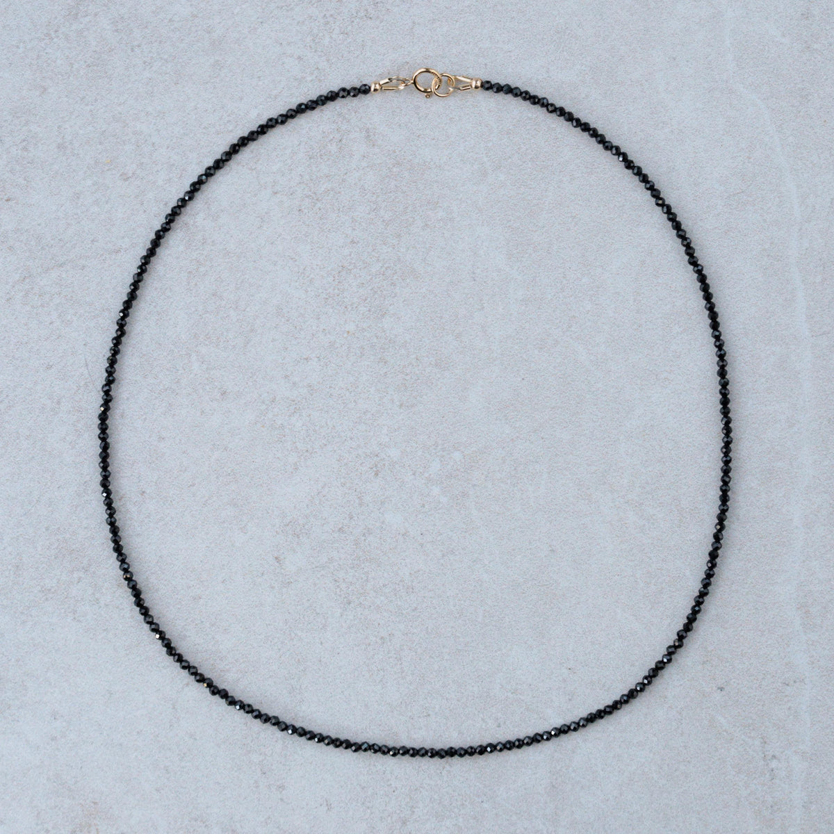 Black Spinel necklace from Earthly Abundance Jewelry featuring a sleek, elegant design with faceted black spinel stones.