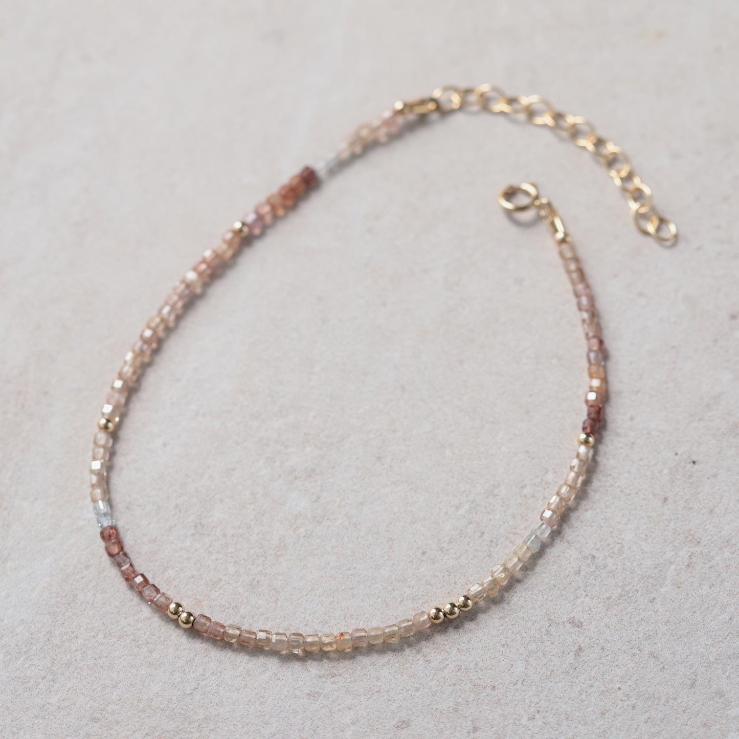Earthly Abundance zircon cube anklet featuring sparkling cubic zirconia stones on a delicate silver chain.