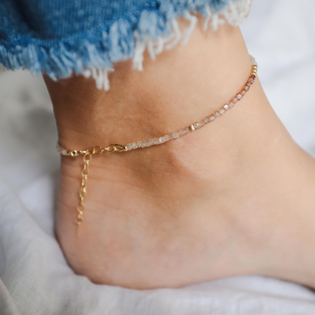 Earthly Abundance zircon cube anklet featuring sparkling cubic zirconia stones on a delicate chain.