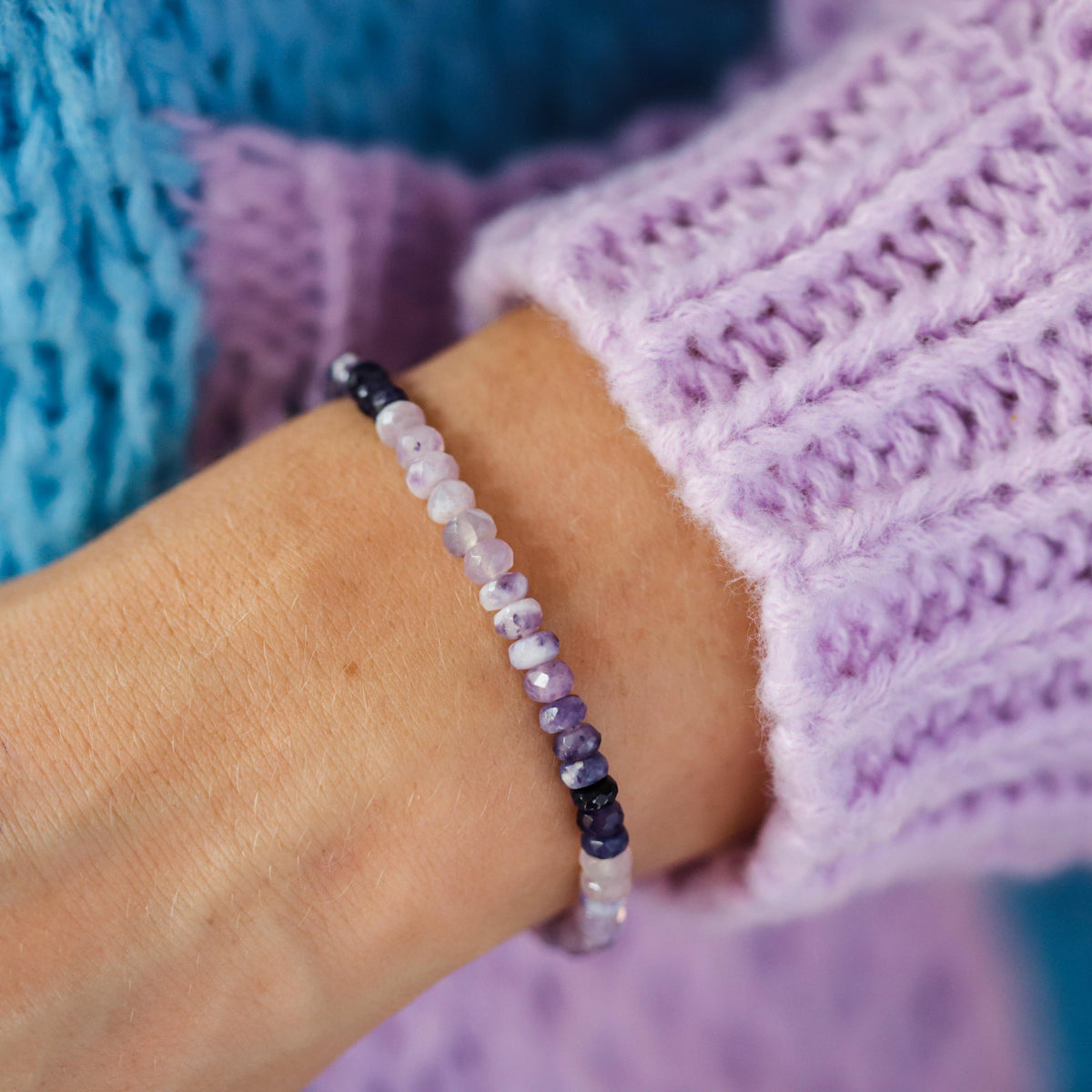 Earthly Abundance Tiffany Purple Opal bracelet featuring vibrant purple opal stones on a delicate silver chain.