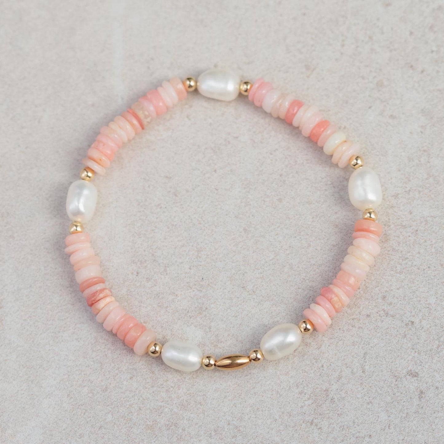 Pink Opal pearl bracelet by Earthly Abundance featuring pink opal beads and a delicate clasp.