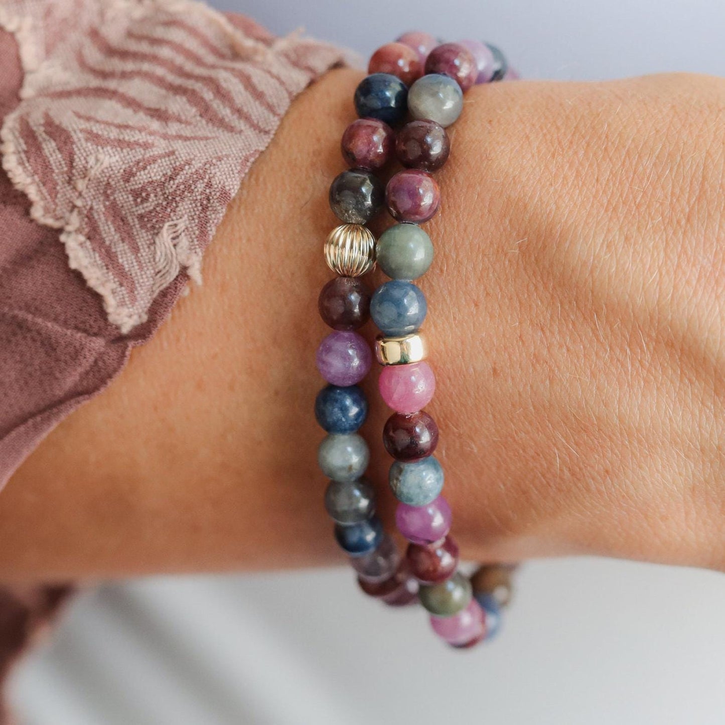 14K Ruby and Sapphire bracelet from Earthly Abundance featuring vibrant red rubies and deep blue sapphires in a delicate design.