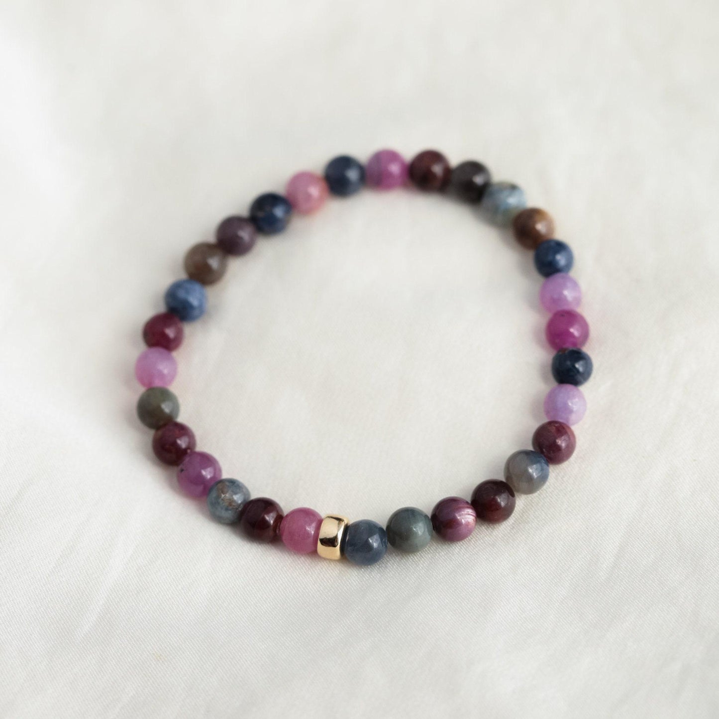 Elegant Ruby and Sapphire bracelet in 14K gold featuring vibrant gemstones from Earthly Abundance.