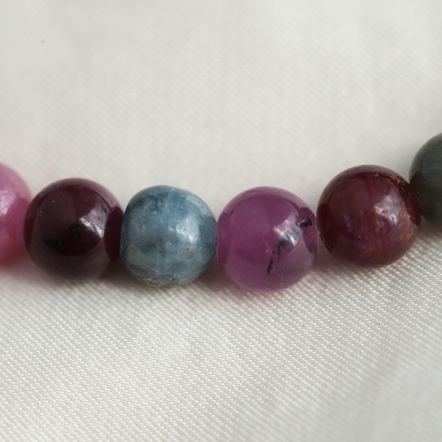 Elegant Ruby and Sapphire bracelet crafted with 14K gold featuring vibrant gemstones from Earthly Abundance.