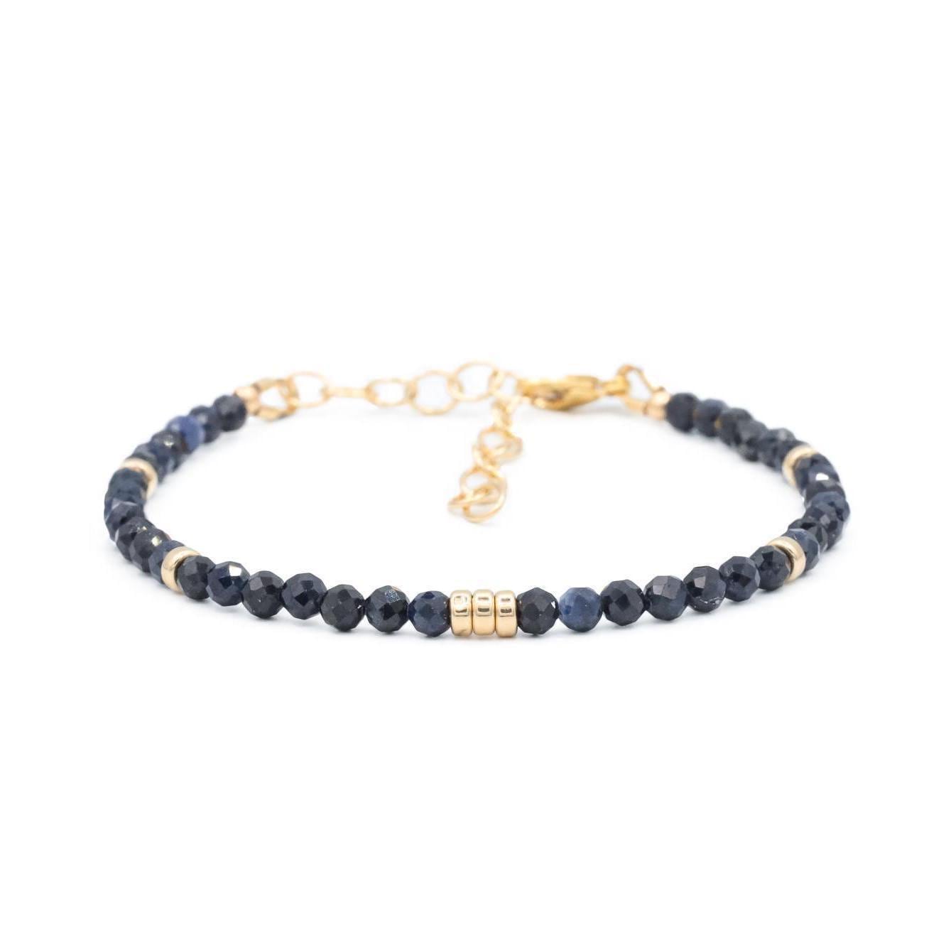 Blue sapphire bracelet by Earthly Abundance Jewelry featuring deep blue sapphires on a delicate silver chain.