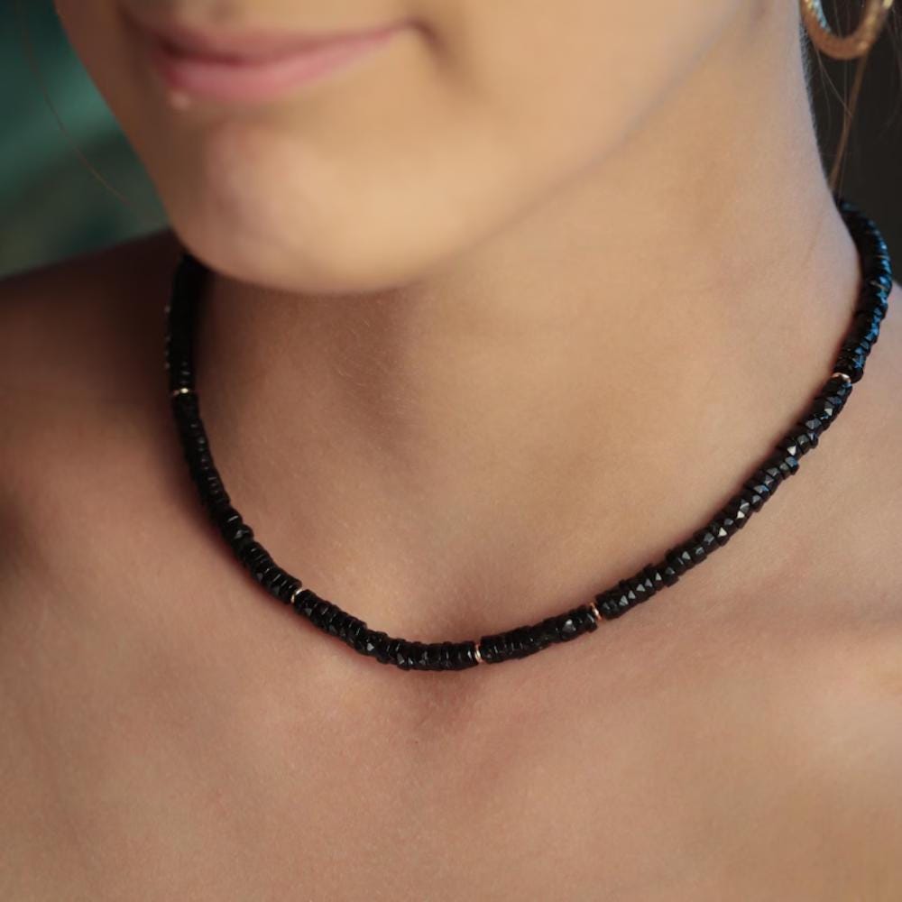 Earthly Abundance Noir Muse Spinel Necklace featuring a sleek black spinel pendant on a delicate chain.