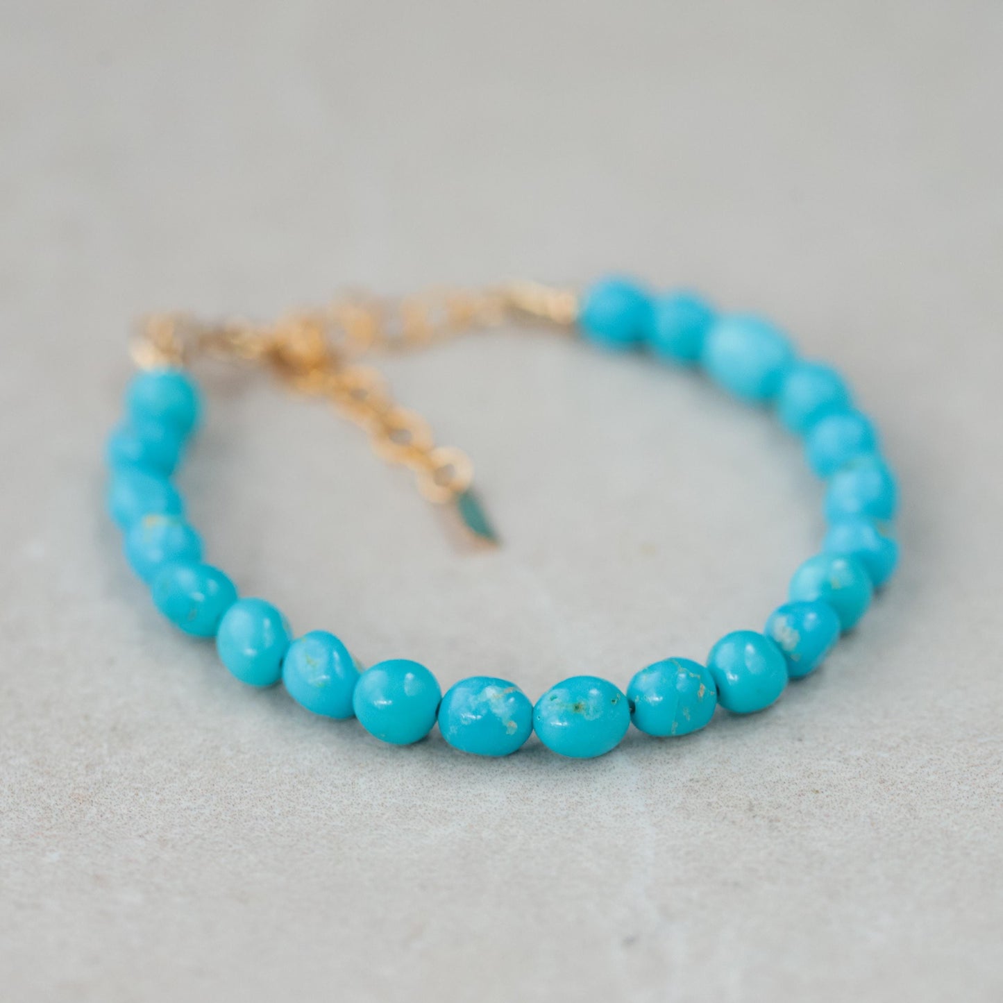 Sleeping Beauty turquoise adjustable ring in 14K gold filled from Earthly Abundance, featuring a vibrant turquoise gemstone setting.