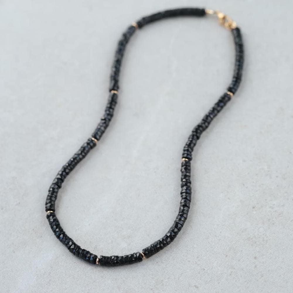 Earthly Abundance Noir Muse Spinel Necklace with dark purple spinel gemstones on a silver chain.