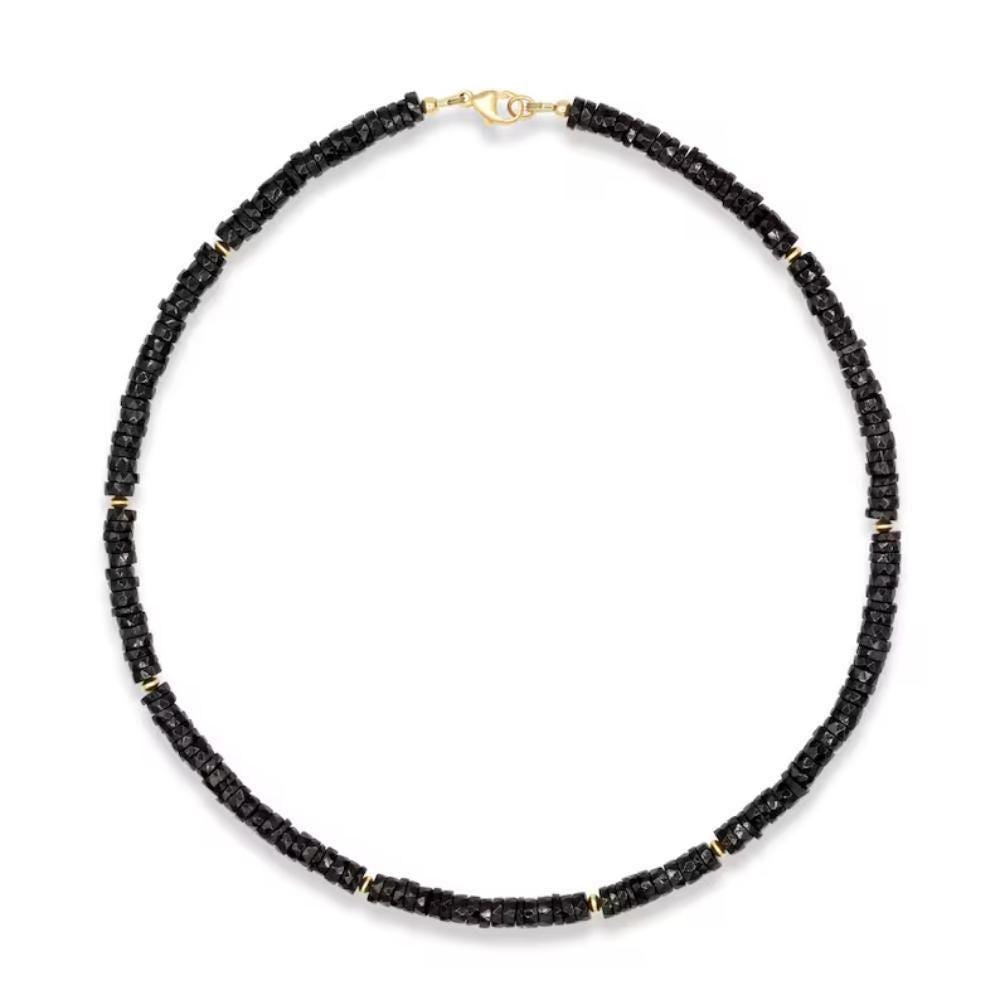 Earthly Abundance Noir Muse Spinel Necklace featuring a delicate chain and a central dark red spinel gemstone.