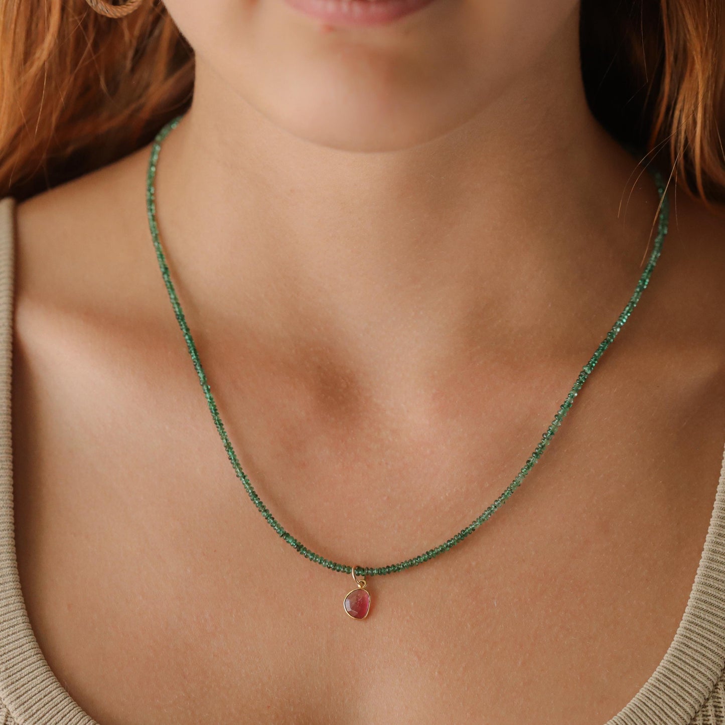 Zambian emerald and pink tourmaline necklace featuring vibrant gemstones on a delicate chain, crafted by Earthly Abundance.