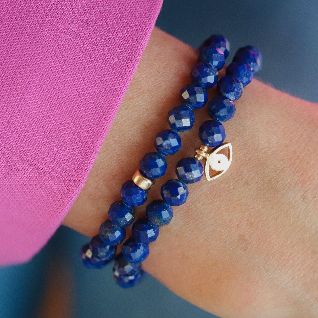 Faceted Lapis Lazuli bracelet from Earthly Abundance Jewelry with deep blue stones and gold-tone accents.