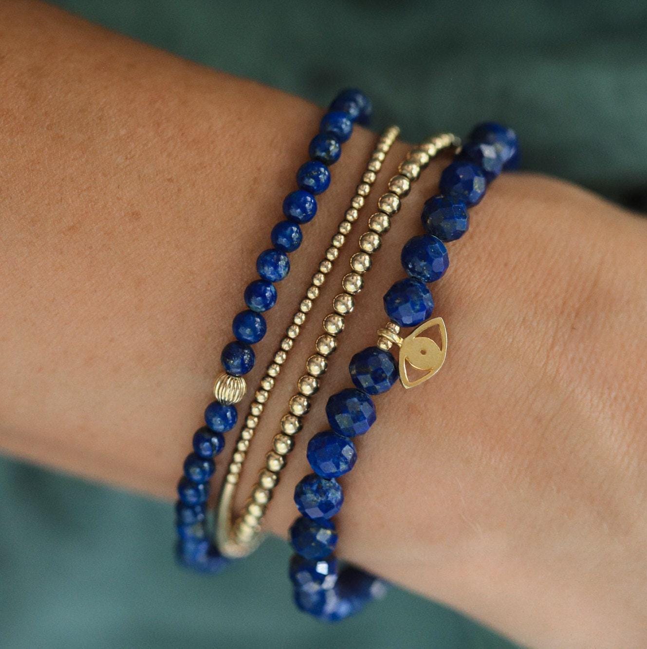 Faceted lapis lazuli bracelet with deep blue stones and gold-tone accents from Earthly Abundance Jewelry.