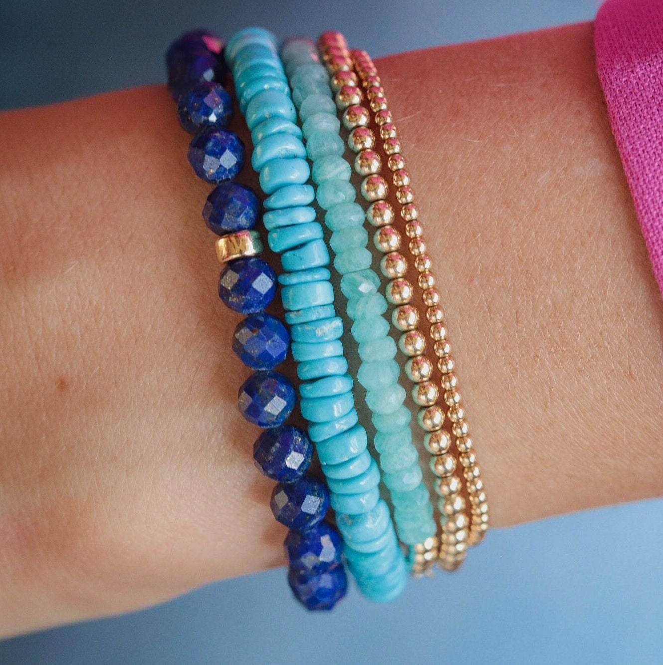 Faceted Lapis Lazuli bracelet from Earthly Abundance Jewelry showcasing deep blue stones with gold-toned accents.