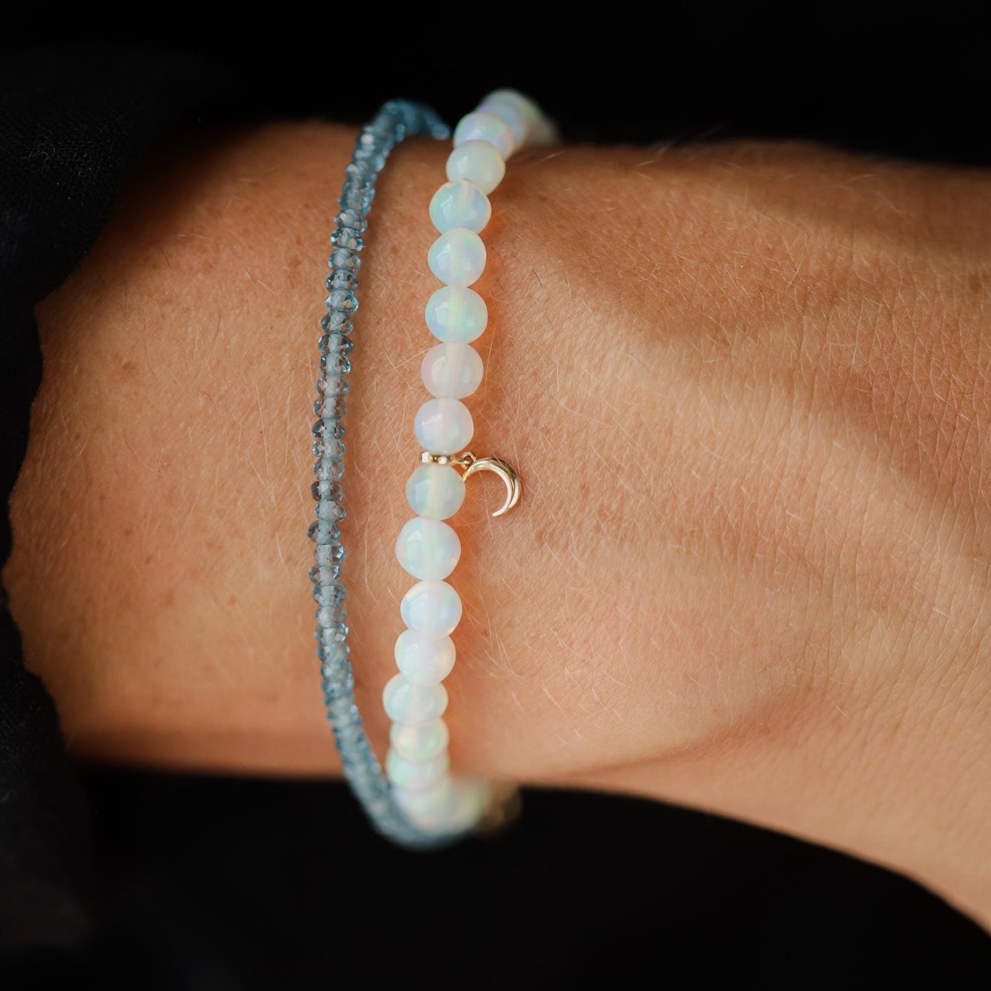 Ethiopian Opal Moon bracelet with 14K gold setting by Earthly Abundance featuring a moon-shaped opal centerpiece.