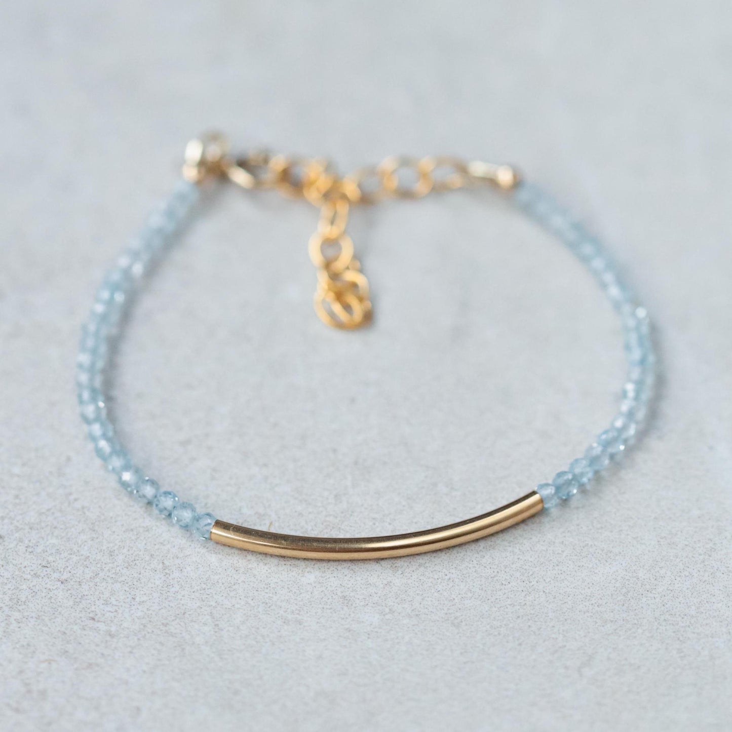 Earthly Abundance Softly Luminous Blue Topaz bracelet with round blue topaz stones on a delicate silver chain.