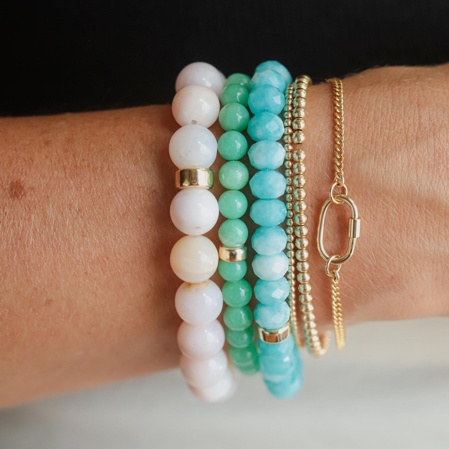 Pink opal bracelet with 14K gold accents from Earthly Abundance, showcasing vibrant pink stones and elegant design.