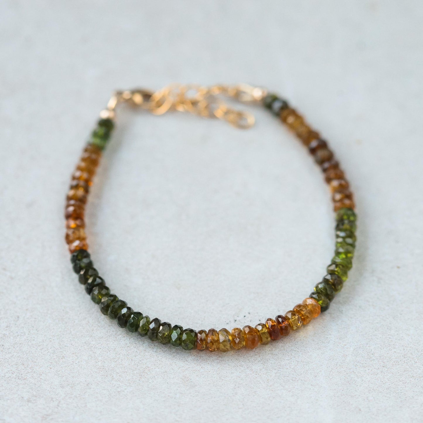 Earthly Abundance Petro Tourmaline bracelet featuring polished round stones on a delicate elastic band.