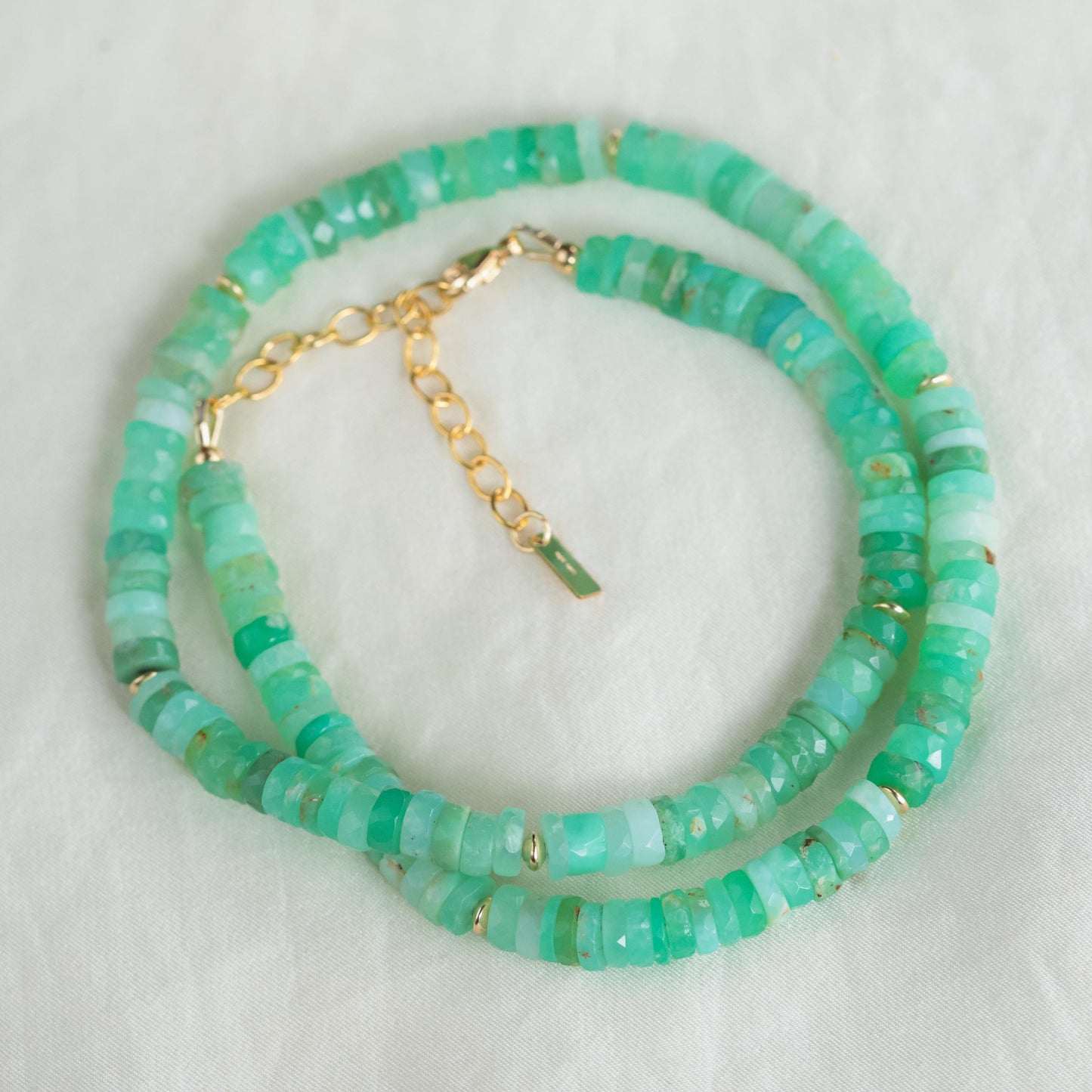 Chrysoprase Heishi necklace featuring smooth green gemstone beads from Earthly Abundance, close-up view of the handcrafted jewelry.