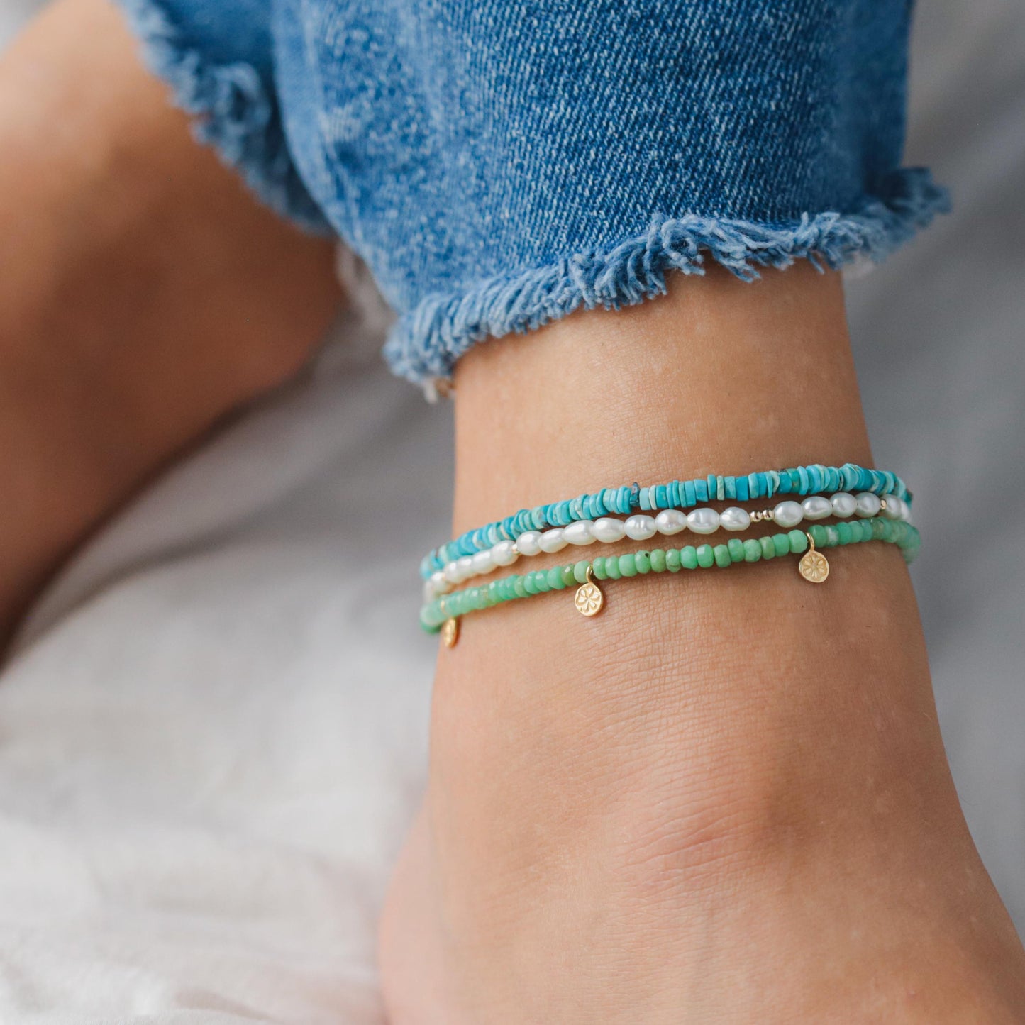 Earthly Abundance turquoise heishi anklet with earthy textured beads, designed for a stylish, natural look around the ankle.