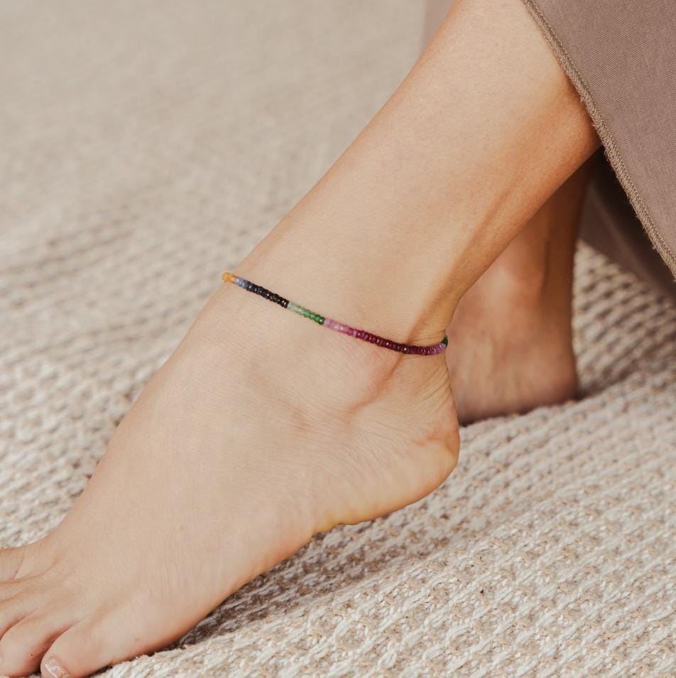 Multi sapphire anklet by Earthly Abundance featuring a delicate chain adorned with colorful sapphire gemstones.