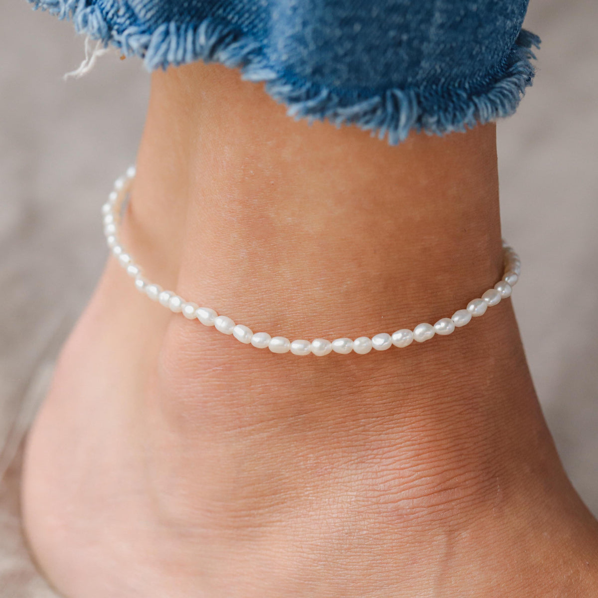 Fresh water pearl anklet with 14K gold clasp from Earthly Abundance, featuring delicate freshwater pearls on a fine gold chain.
