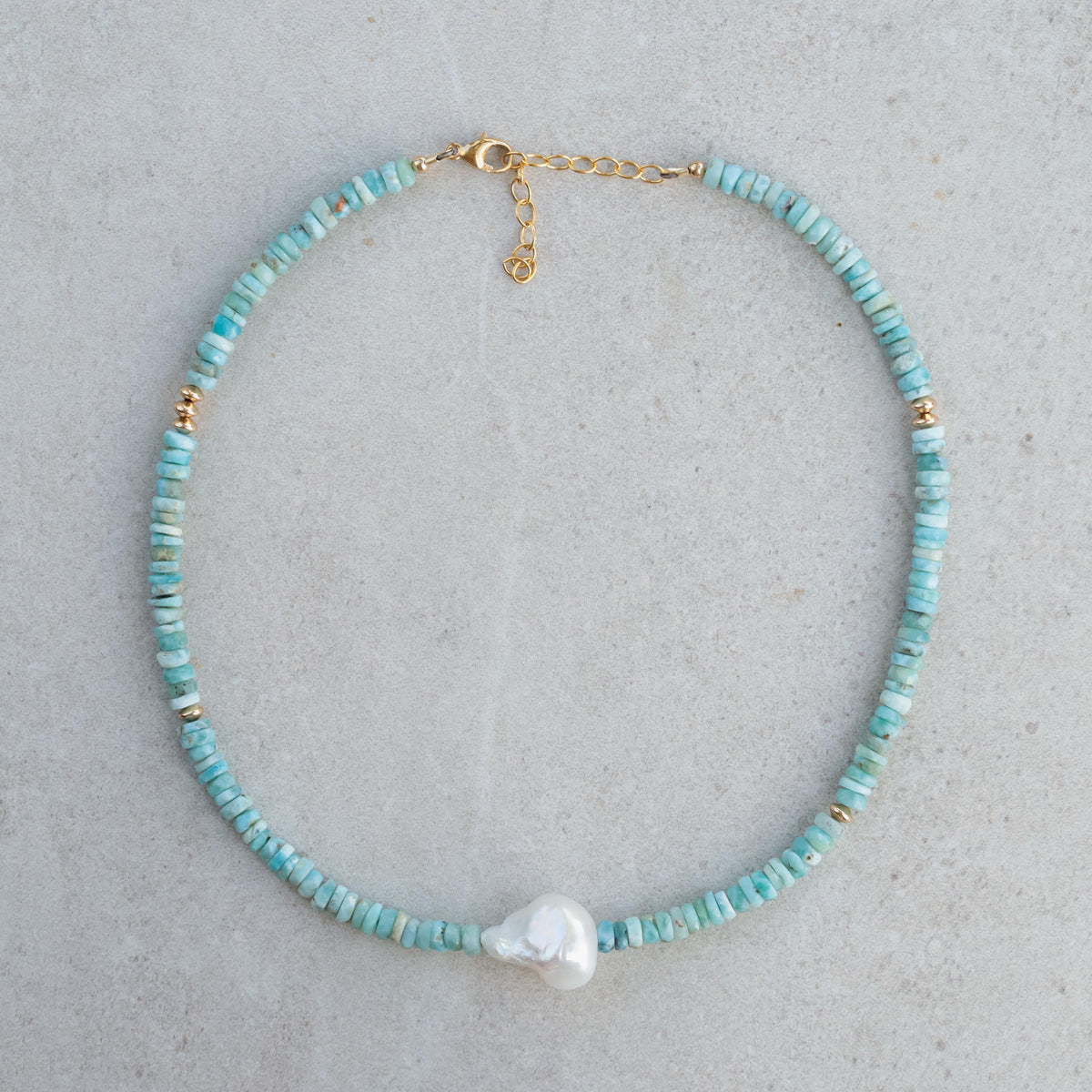 Larimar heishi and baroque pearl necklace by Earthly Abundance, featuring blue gemstone beads and irregular pearl shapes.