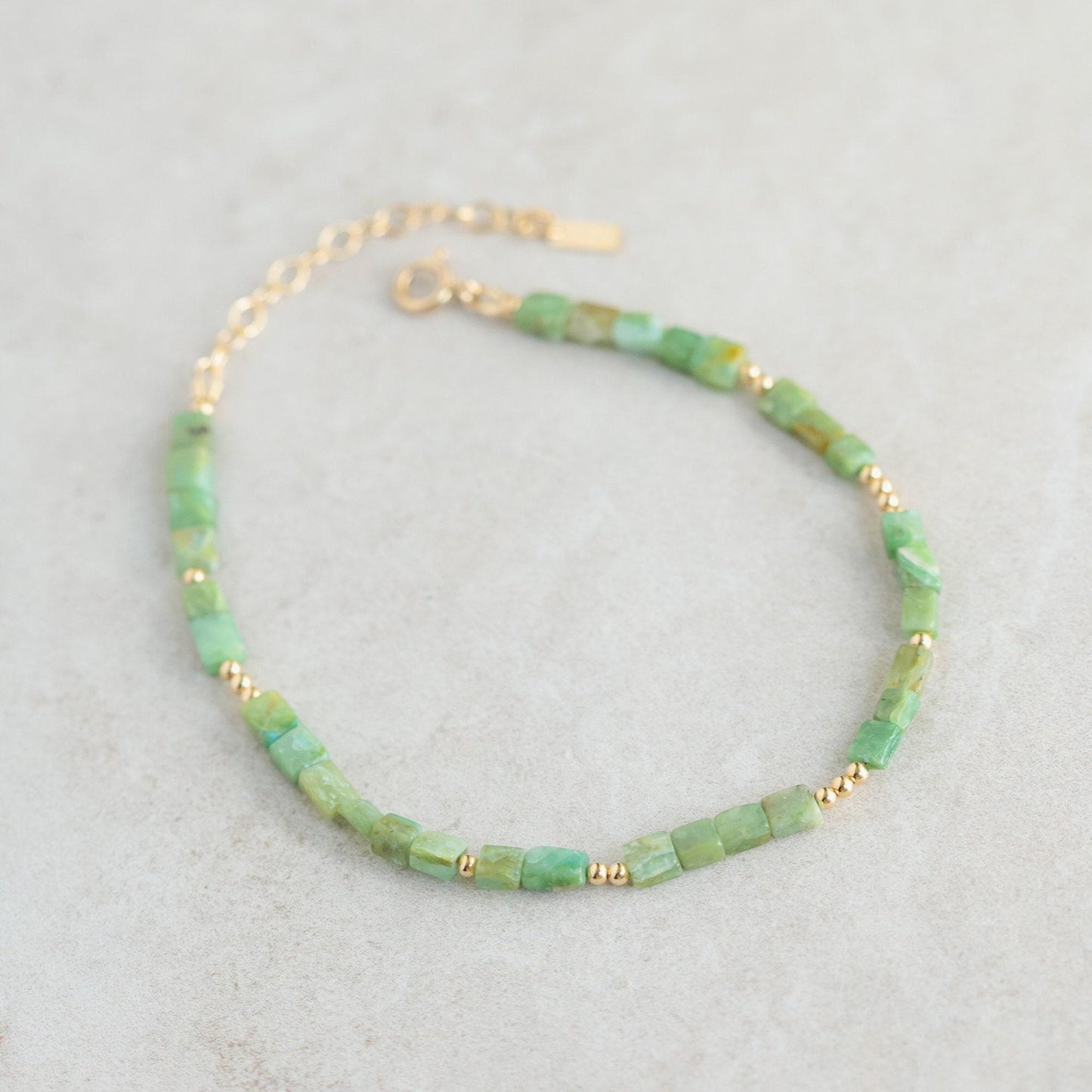 Square cut Peruvian Opal anklet with 14K gold filled chain from Earthly Abundance, showing the jewelry detail and elegant design.