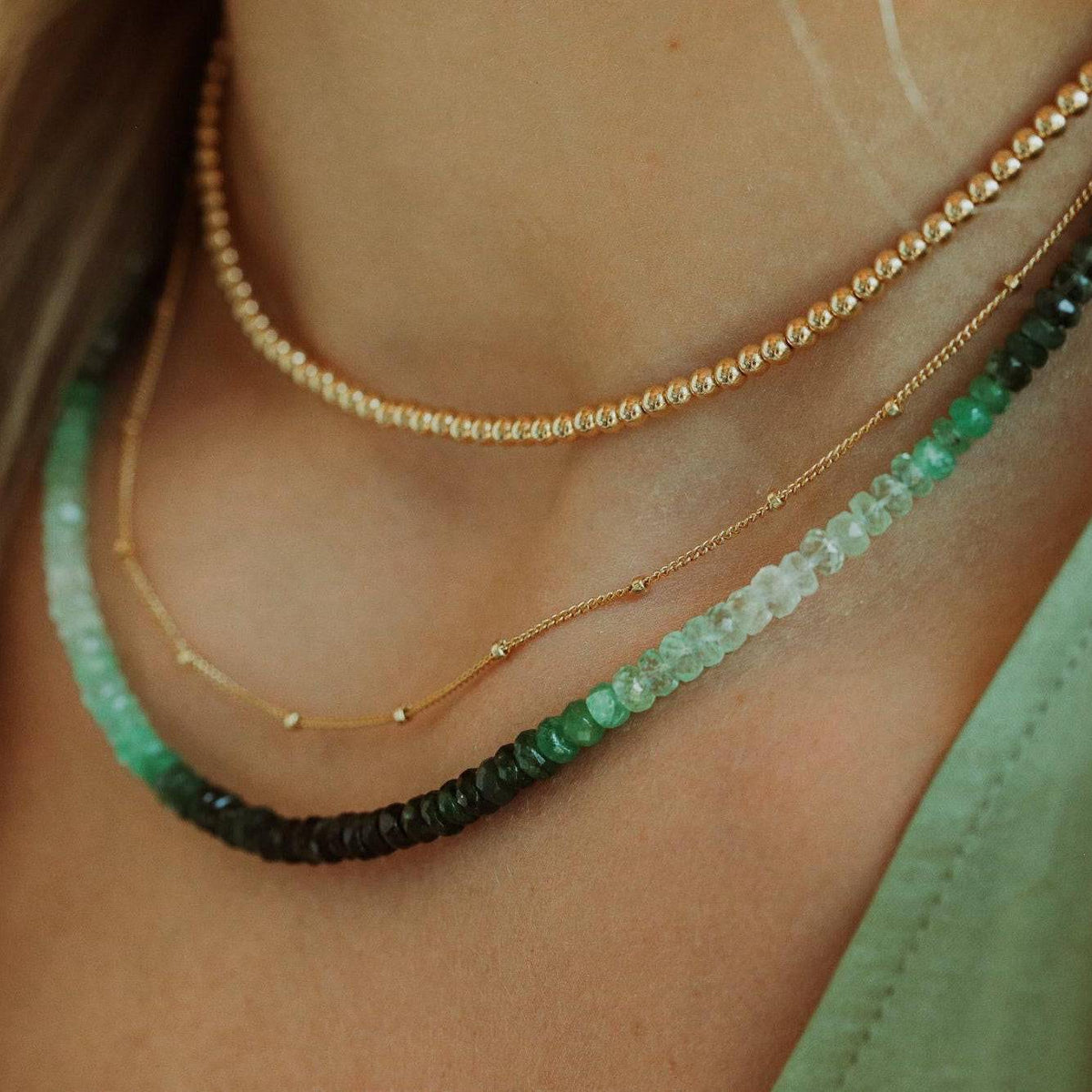 Ombre emerald necklace from Earthly Abundance Jewelry featuring a gradient green gemstone pendant on a silver chain.