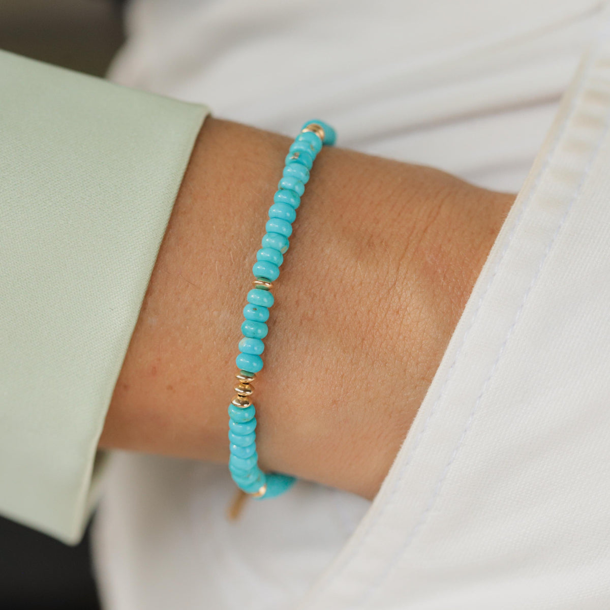 Smooth Rondel Sleeping Beauty turquoise gemstone bracelet by Earthly Abundance, featuring polished blue turquoise beads.