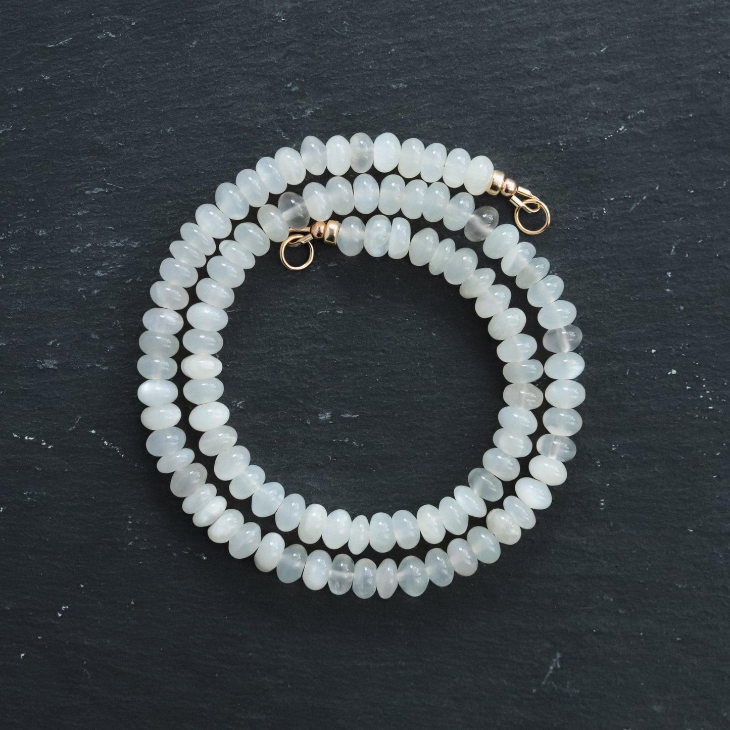 Driftlight Moonstone Necklace by Earthly Abundance featuring a polished moonstone pendant on a delicate chain.