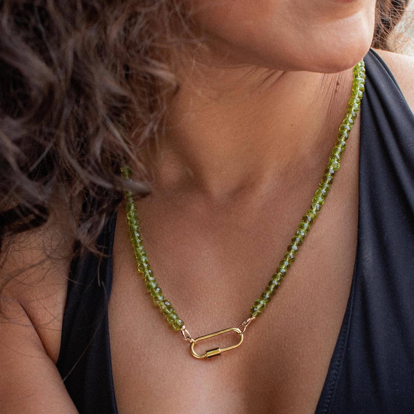 Peridot Carabiner necklace featuring a vibrant green peridot gemstone on a silver chain by Earthly Abundance