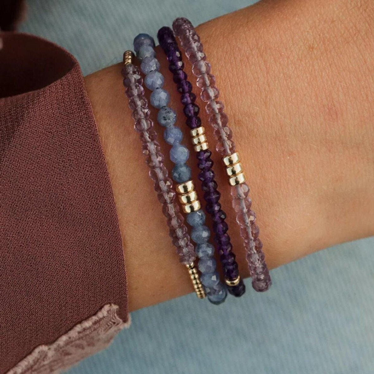 African Amethyst bracelet by Earthly Abundance Jewelry featuring polished purple amethyst beads on a stretch cord.