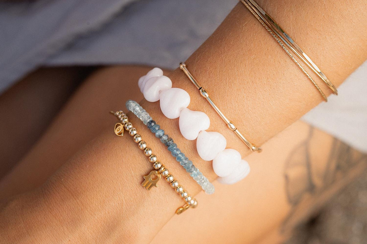 Earthly Abundance Santorini Blue Aquamarine Bracelet featuring vibrant blue aquamarine beads on a delicate chain.