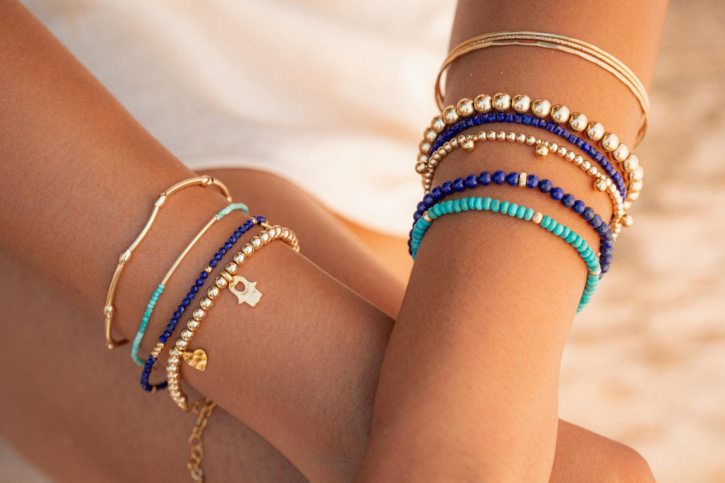 Lapis Lazuli cube bracelet with 14K gold accents by Earthly Abundance, showcasing polished blue gemstone cubes on a delicate chain.