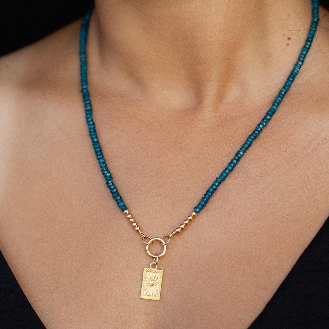 Oceanic Apatite Carabiner Necklace by Earthly Abundance featuring a silver-tone carabiner pendant with blue apatite gemstone.