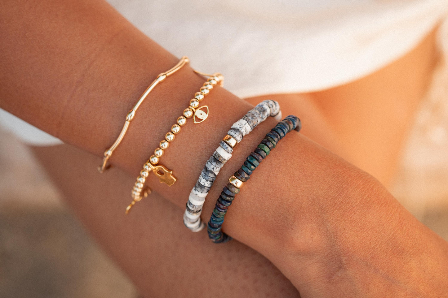 Dendrite and black spinel heart bracelet made with 14K gold by Earthly Abundance, featuring intricate gemstone details.