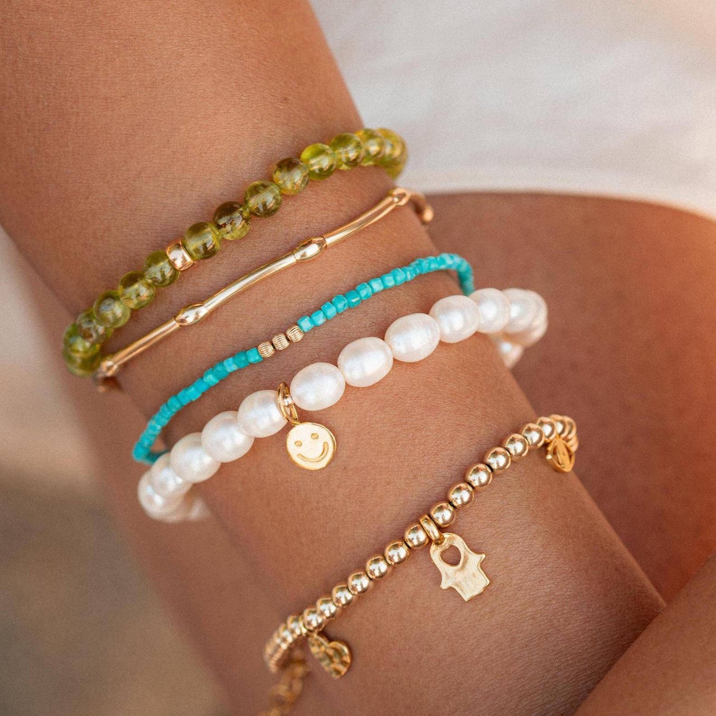 Turquoise beaded bracelet by Earthly Abundance featuring round turquoise beads on an elastic cord for a stylish, natural look.