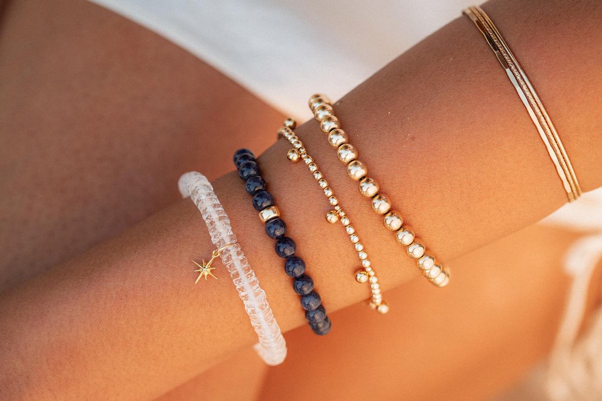 White Topaz Heishi bracelet featuring smooth, round white topaz stones on a flexible string, crafted by Earthly Abundance.