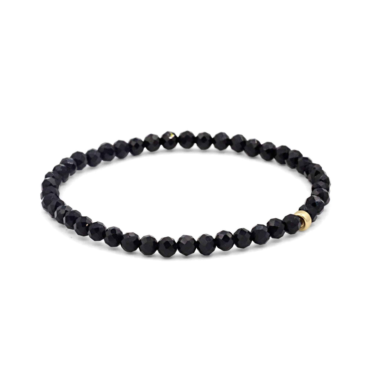 Black Onyx bracelet featuring 14K gold accents from Earthly Abundance, showcasing smooth, polished black gemstone beads.